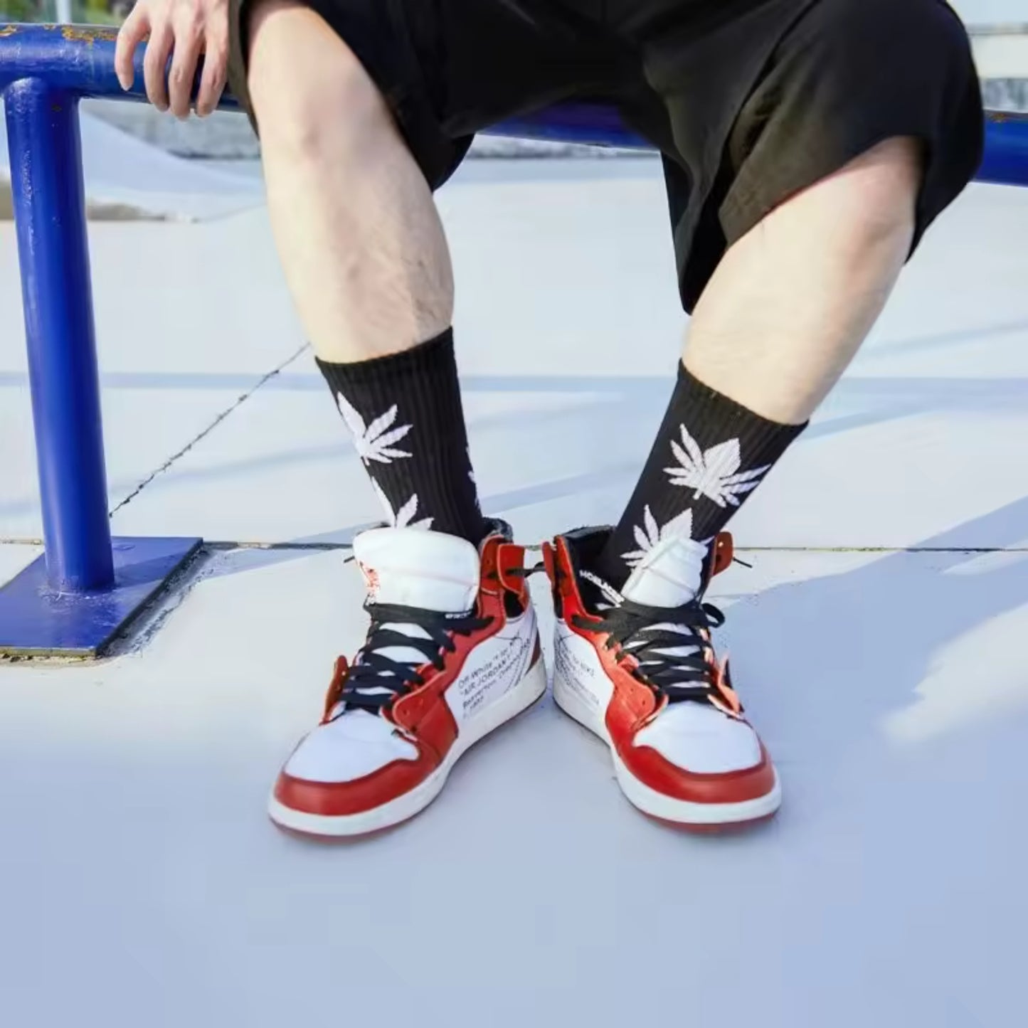 a man wearing weeds socks and tennis shoes