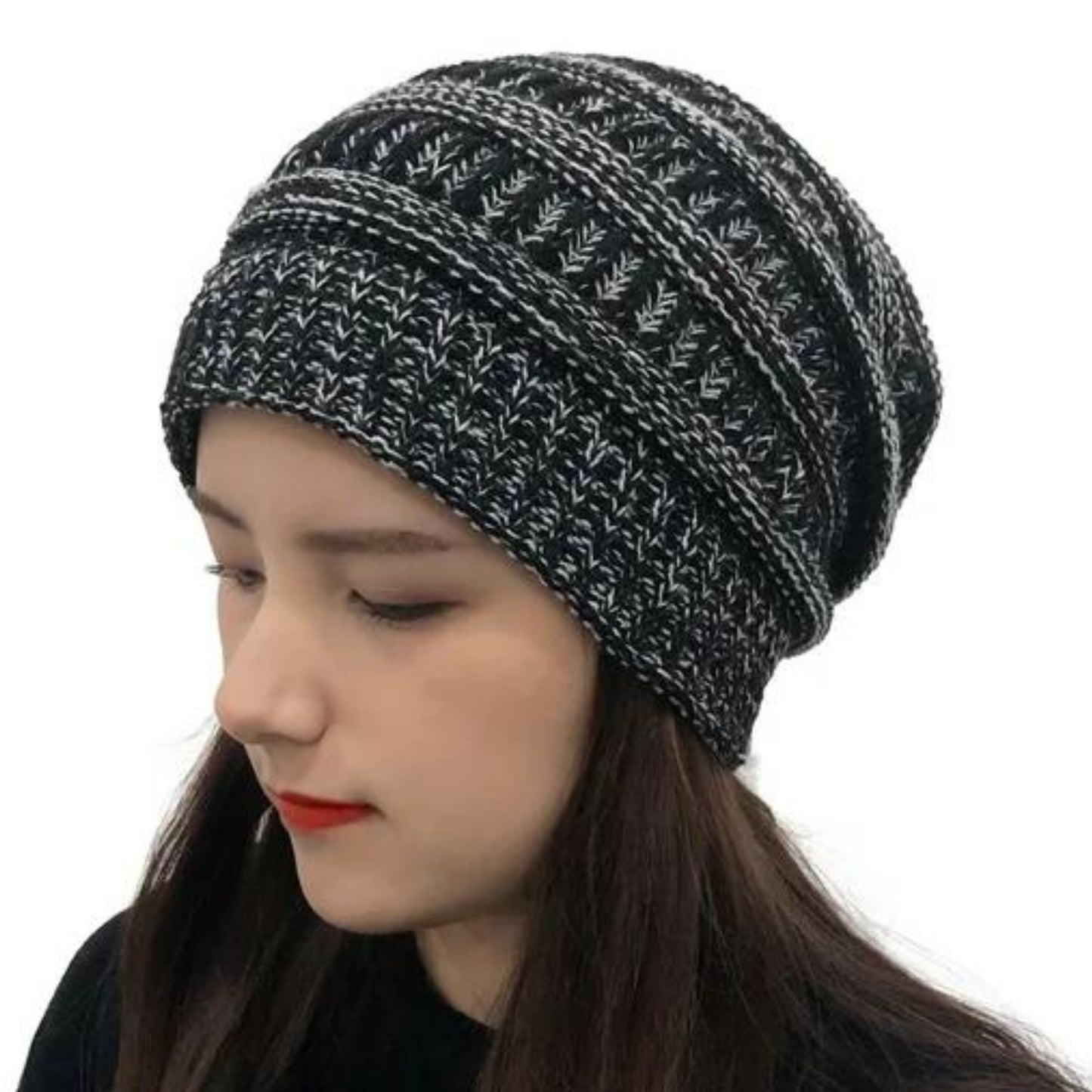 women wearing a black and white knitted satin lined beanie hat