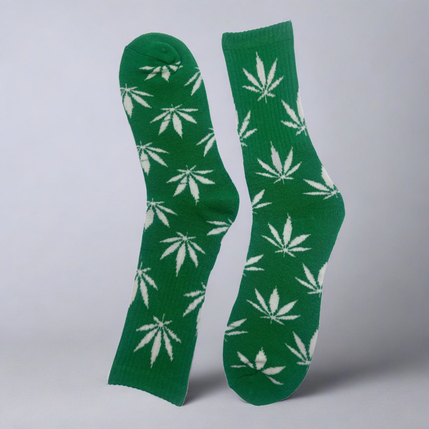 green crew socks with white marijuana leaves