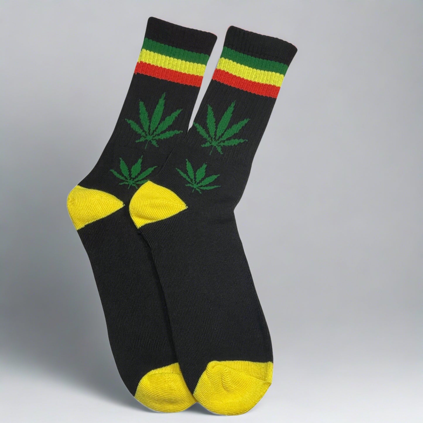 black crew socks with green marijuana leaves, yellow toe and heel, and green yellow red stripe